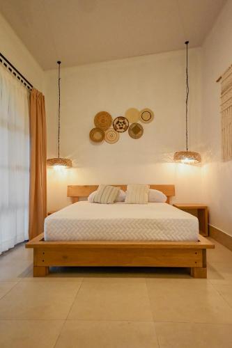 Postel nebo postele na pokoji v ubytování ZAFRA'S HOTEL