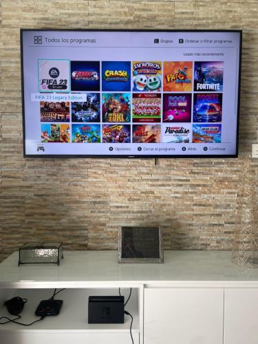 Televisyen dan/atau pusat hiburan di Apartamento Isabella suite