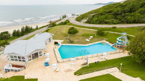 an aerial view of a house and a swimming pool at Samba Laguna Tourist Hotel in Laguna