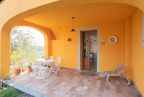 a room with a table and chairs on a patio at Agriturismo La Pineta in Fucecchio