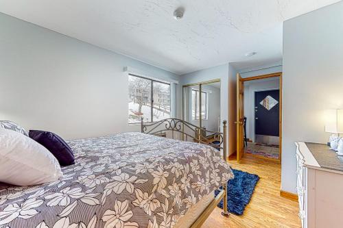a bedroom with a bed and a window at Lakeside Delight, unit 423 in Laconia