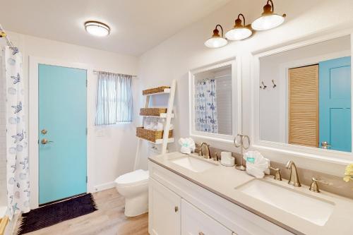 a bathroom with a sink and a toilet at The Beach Sunflower in Pensacola Beach