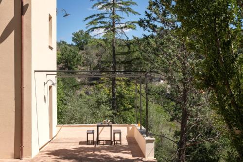 a view from the balcony of a house with a table and chairs at Piano del Mulino in Orvieto