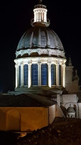 a building with a tower with lights on it at Casa Vacanze La Fenice - Casa Atlantica in Cava dʼAliga