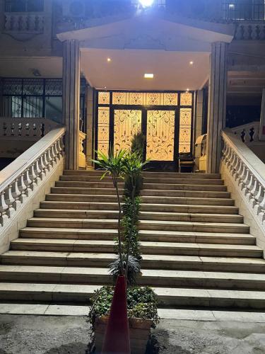 a set of stairs in front of a building at Asia Grand Museum & Pyramids view in Cairo