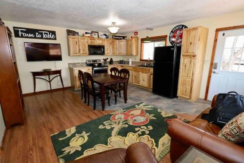 a kitchen and dining room with a table and chairs at Hidden gem close to fairgrounds in Redmond