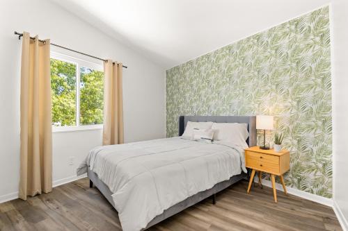 a bedroom with a large bed and a window at The Concord Place in Peoria