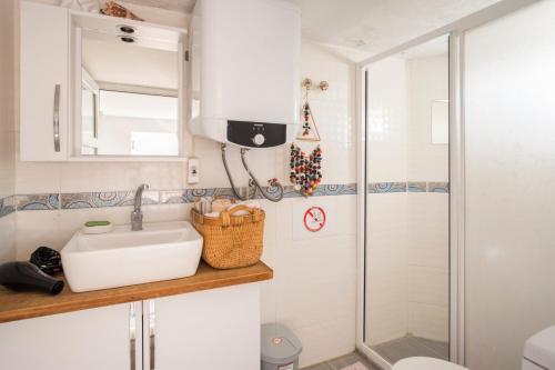 a bathroom with a sink and a shower at Central, Cozy, Comfy, 1BR House, Free Parking & Fast Wi-Fi, 4ppl in Bodrum City