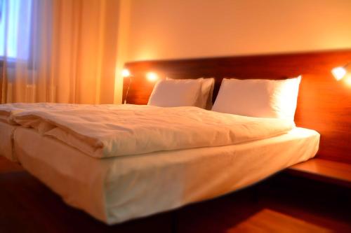 Postel nebo postele na pokoji v ubytování Monte Hotel