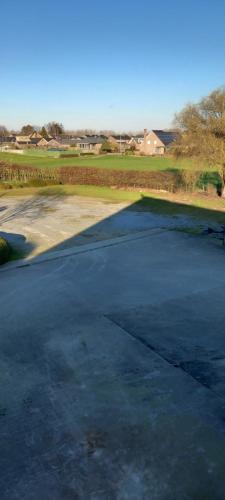 an empty parking lot with a golf course at Wenceslas Cobergher Penthouse in Boutersem