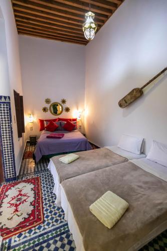 Cama o camas de una habitación en Fez Dar
