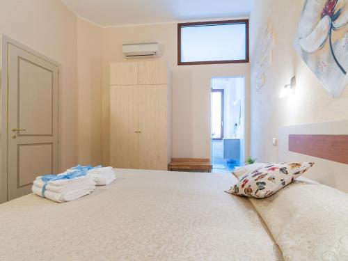 Ένα ή περισσότερα κρεβάτια σε δωμάτιο στο Il Borgo