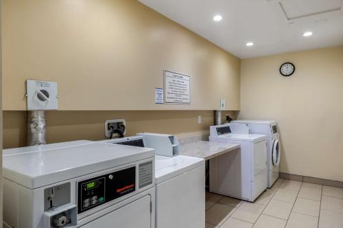a laundry room with white appliances in a room at Best Western Plus South Coast Inn in Santa Barbara