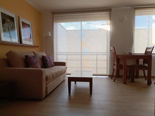 a living room with a couch and a table at Hotel Boutique Confort Suites in Popayan