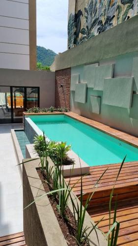 a swimming pool on the side of a building at Departamento - Salta Capital cg - Edificio Usina in Salta