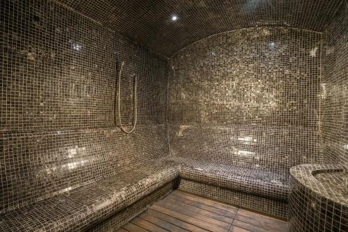 a tiled bathroom with a tub and a sink at Sheraton Ankara Hotel & Convention Center in Ankara