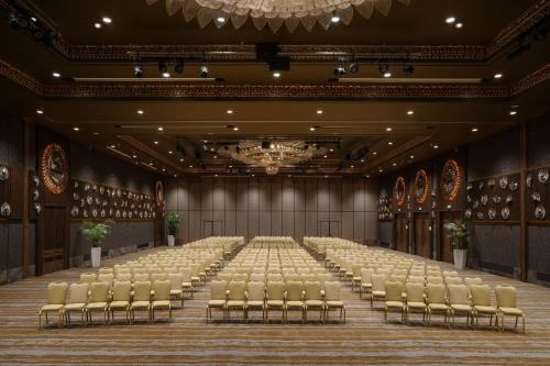 an empty banquet hall with chairs and a stage at Sheraton Ankara Hotel & Convention Center in Ankara