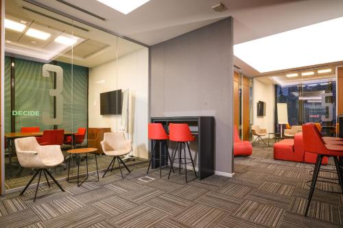 a conference room with red chairs and a large number nine at Sheraton Ankara Hotel & Convention Center in Ankara