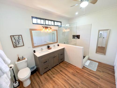a bathroom with a sink and a toilet and a shower at Westend House Newly Renovated 3 Bedroom in Petit Valley