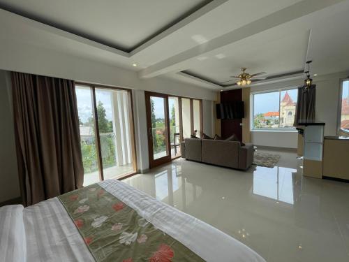 Ένα ή περισσότερα κρεβάτια σε δωμάτιο στο GM Guest House Canggu