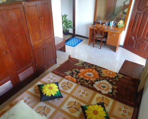 an aerial view of a living room with a rug at Asoka Resident Kalutara in Kalutara