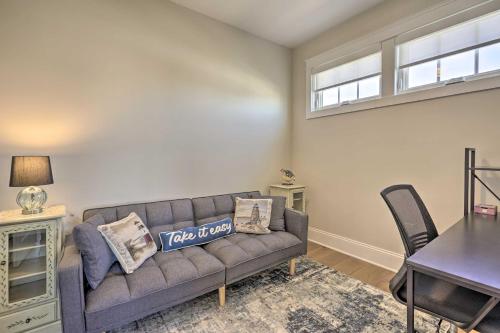 a living room with a couch and a table at Long Branch Home Less Than 1 Mi to Beach! in Long Branch