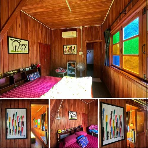 a bedroom with wood paneling and a bed in a room at กิ่วลม - ชมลคอร Kiwlom - Chomlakorn, Lampang, TH in Lampang