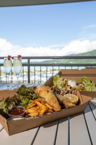 a box of food sitting on top of a table at Club Wyndham Airlie Beach in Airlie Beach