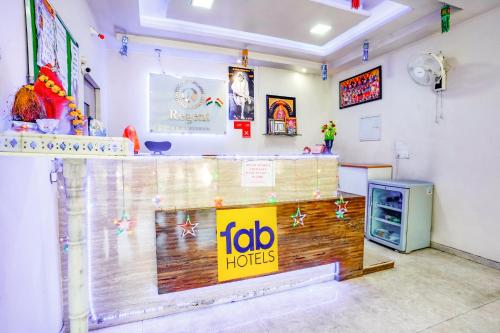 a room with a tabo hotel sign on the wall at FabHotel Regent Inn - Nr SkyWalk Bridge in Pune