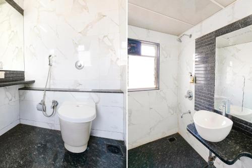 a bathroom with a toilet and a sink at FabHotel Regent Inn - Nr SkyWalk Bridge in Pune