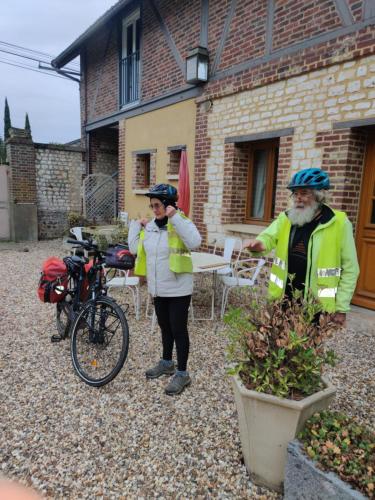 two people wearing helmets standing in front of a house at Le Val d'Andé in Andé