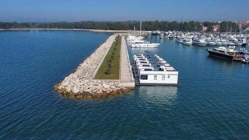 an aerial view of a marina with boats in the water at The Sea Lodges Novigrad - Hausboot Floating Sea House in Novigrad Istria