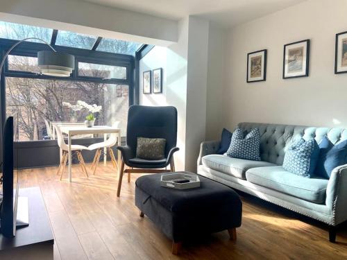 a living room with a couch and chairs and a table at The Imp’s Pad - Off Steep Hill - Private Parking in Lincolnshire