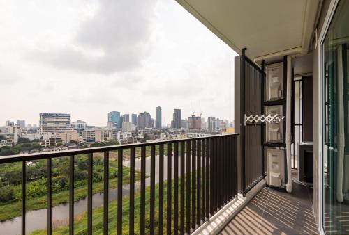 a balcony with a view of the city at Maitria Hotel Rama 9 Bangkok - A Chatrium Collection in Bangkok