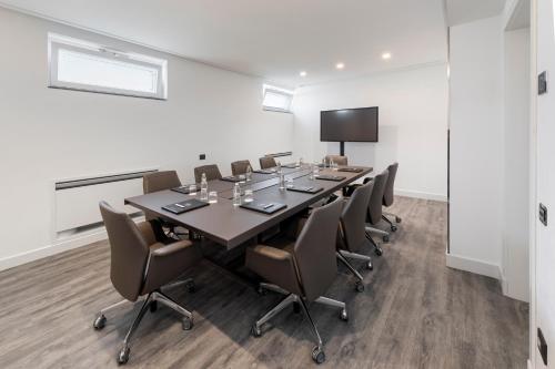 a conference room with a long table and chairs at LHP Napoli Palace & SPA in Naples