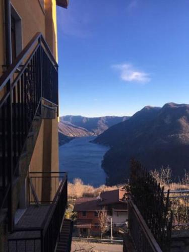 a view of a lake from a balcony of a building at VillaMarinaPigra Lake View Apartments in Pigra