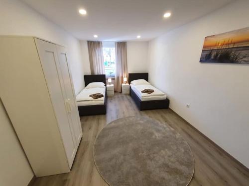 Postel nebo postele na pokoji v ubytování WoHntel Hannover Ricklingen