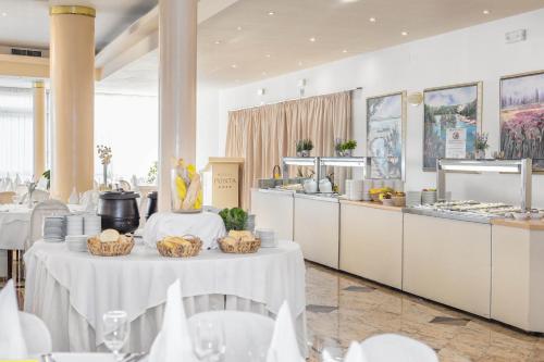 a restaurant with two tables with baskets of food at Villa Arausa in Vodice