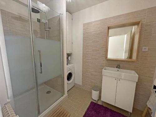 a bathroom with a shower and a sink and a toilet at Lovely Suite Nimes Romaine in Nîmes