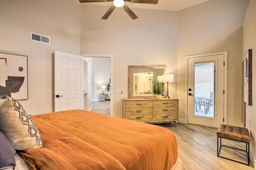 a bedroom with a bed and a dresser and a mirror at Golf Course View, Community Perks Surprise Home in Surprise