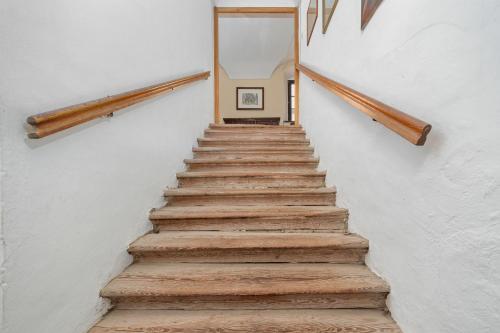 a stairway with wooden steps in a building at Schloss Berg Klösterle in Zedlitzdorf