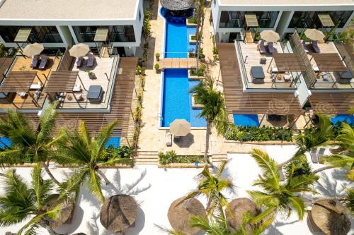 an aerial view of a resort with palm trees and a swimming pool at TOA Hotel & Spa Zanzibar in Pongwe
