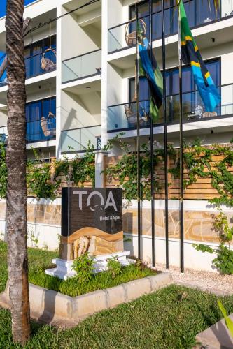 a taa sign in front of a building at TOA Hotel & Spa Zanzibar in Pongwe