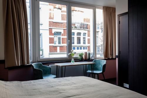 Ένα ή περισσότερα κρεβάτια σε δωμάτιο στο Hey - Aparthotel Brussels