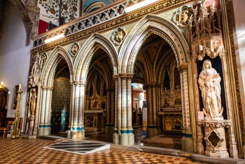 a room with a statue of a woman in a building at Ushaw Historic House, Chapels & Gardens in Durham