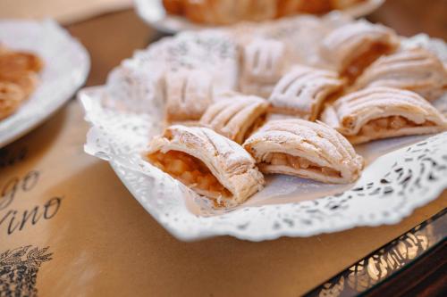 a plate of pastries sitting on a table at Hotel Leon D´Oro in Prague