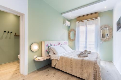a bedroom with a bed and a window at ANNA'S DREAM BED & BREAKFAST in Avola