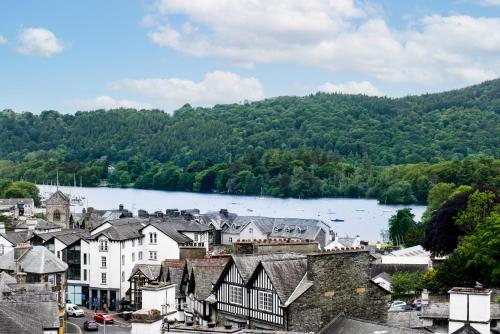 a view of a town with a river and trees at Oakbank at The Angel Inn in Bowness-on-Windermere