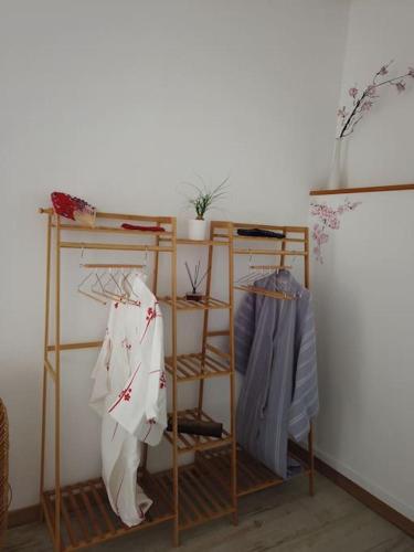 a room with two shelves with umbrellas on them at Villa piscine balnéothérapie et jacuzzi entièrement privée in Barras