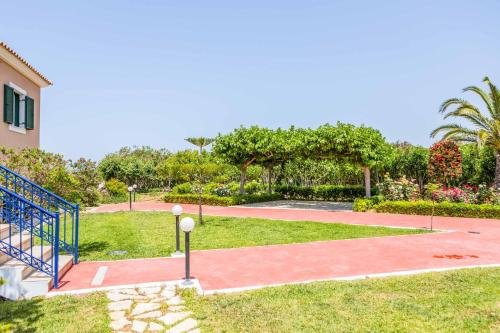 a basketball court in a park next to a building at Villa Alba Minies in Minia